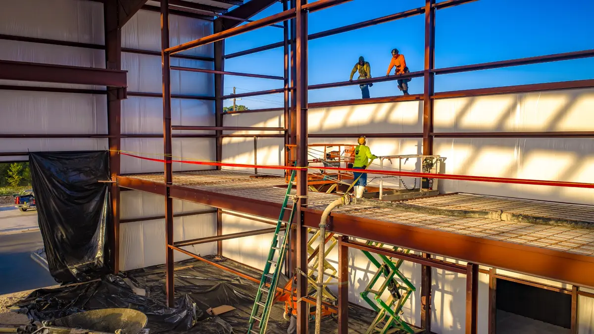 Steel-framed metal building under construction